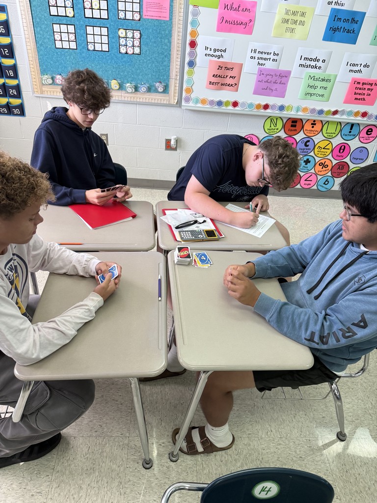 Today in Mrs. Kaple's Honors Geometry the students played UNO to get ready for Geometric Proofs. UNO is used to introduce proofs because it leverages a familiar game to teach abstract concepts by modeling them as a step-by-step puzzle with clear rules. Students can connect to the concept of a proof through the act of playing UNO cards to get from a "given" card to a "prove" card. The rules of UNO serve as the "postulates" or "reasons" for each step (card) in the sequence, helping students understand deductive reasoning and the logical justification required for a formal proof in a hands-on, engaging way.