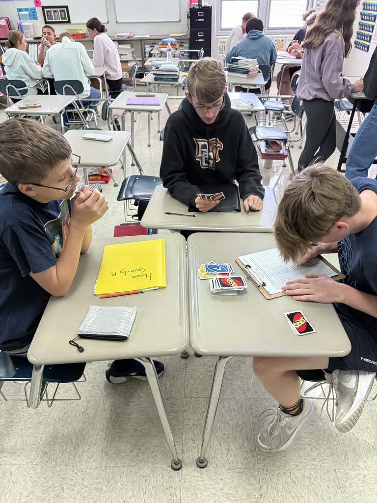 Today in Mrs. Kaple's Honors Geometry the students played UNO to get ready for Geometric Proofs. UNO is used to introduce proofs because it leverages a familiar game to teach abstract concepts by modeling them as a step-by-step puzzle with clear rules. Students can connect to the concept of a proof through the act of playing UNO cards to get from a "given" card to a "prove" card. The rules of UNO serve as the "postulates" or "reasons" for each step (card) in the sequence, helping students understand deductive reasoning and the logical justification required for a formal proof in a hands-on, engaging way.