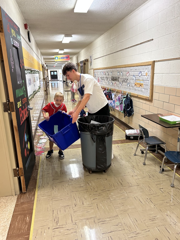 Maplehurst first grade students from Mrs. Smarr and Mrs. Enderle’s class are the leaders this week. Students are greeting their peers at the doors this week, doing the announcements and today they collected recycling with the high school TLC students. 
