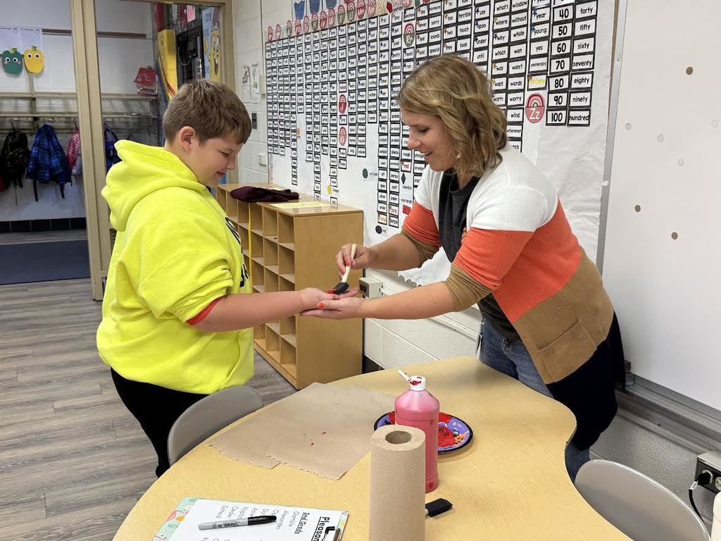 2nd & 3rd Graders at Pleasant Elementary collaborated to make a handprint flag in honor of our Veteran family members and friends. It is hanging on display in the gym/cafeteria.