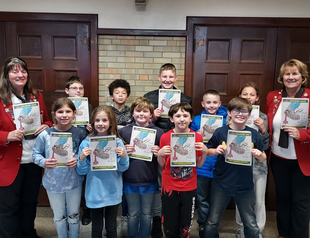 Norwalk's local Elks delivering their Drug Awareness Program coloring books to our current 5th grade class. Some of our students are pictured here with 2 of the members. Thank you Norwalk Elks #730!