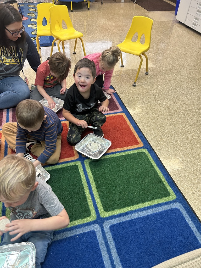 Preschool students from Mrs. Golden and Mrs.Lesch’s class had a guest visitor, Mrs.Jude, come to class and talk about dinosaurs. The first lesson a couple of weeks ago, the students learned the names of dinosaurs, what they ate and how big they really were. She brought  a life size paper foot of a T-Rex and the students each put one shoe inside the foot to see how many shoes it would take to fill it. Fridays lesson enabled them to be paleontologists, each student used a brush and toothpick to dig for dinosaur bones, each student excitedly and successfully found a dinosaur! Thank you to Mrs. Jude for a fun and educational experience. 
