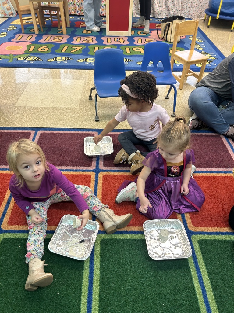 Preschool students from Mrs. Golden and Mrs.Lesch’s class had a guest visitor, Mrs.Jude, come to class and talk about dinosaurs. The first lesson a couple of weeks ago, the students learned the names of dinosaurs, what they ate and how big they really were. She brought  a life size paper foot of a T-Rex and the students each put one shoe inside the foot to see how many shoes it would take to fill it. Fridays lesson enabled them to be paleontologists, each student used a brush and toothpick to dig for dinosaur bones, each student excitedly and successfully found a dinosaur! Thank you to Mrs. Jude for a fun and educational experience. 