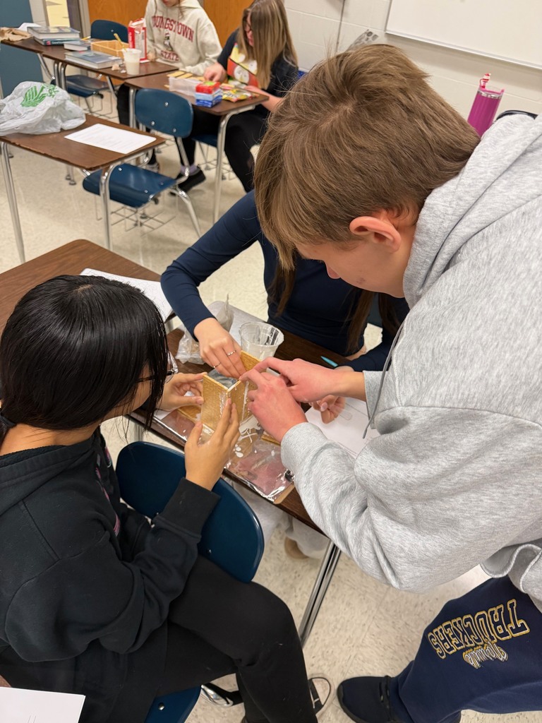 Mrs. Roberts’ math students at Norwalk High School took on a festive hands-on engineering challenge this week: designing and building gingerbread houses! Behind the candy and creativity was meaningful work. Students practiced measurement, geometry, budgeting, planning, and structural reasoning — all essential real-world math skills. They sketched blueprints, calculated pieces, problem-solved in teams, and adjusted their designs as they built. This activity also strengthened important life skills: collaboration, patience, following multi-step directions, and seeing a project through from start to finish. The pride and ownership they showed in their finished houses made the learning even sweeter. 💙 When students learn by doing, the results are as strong as the houses they build.