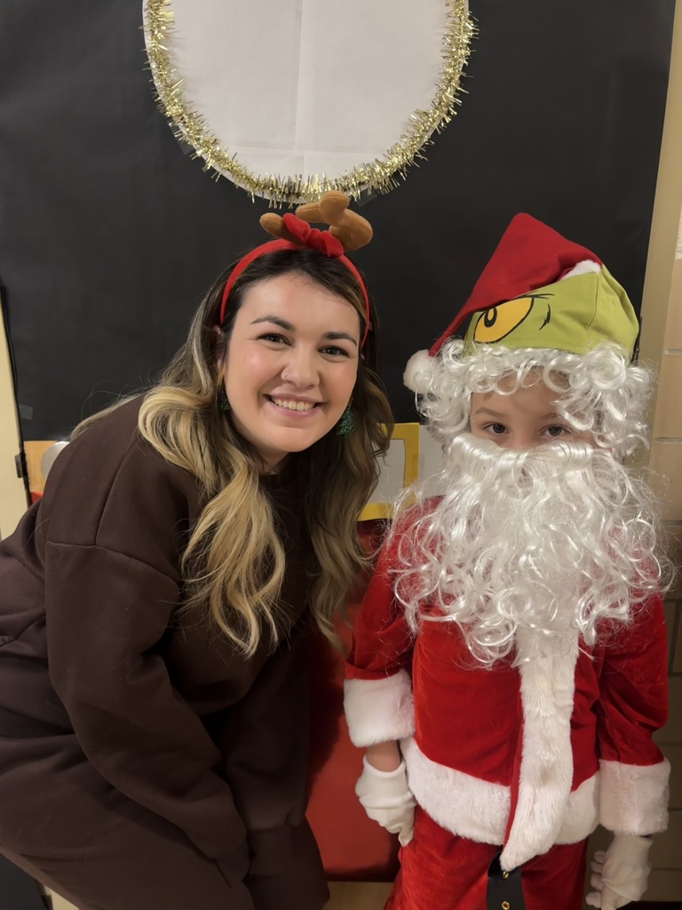 The Grinch disguised as Santa and Max were spotted in First Grade today! 