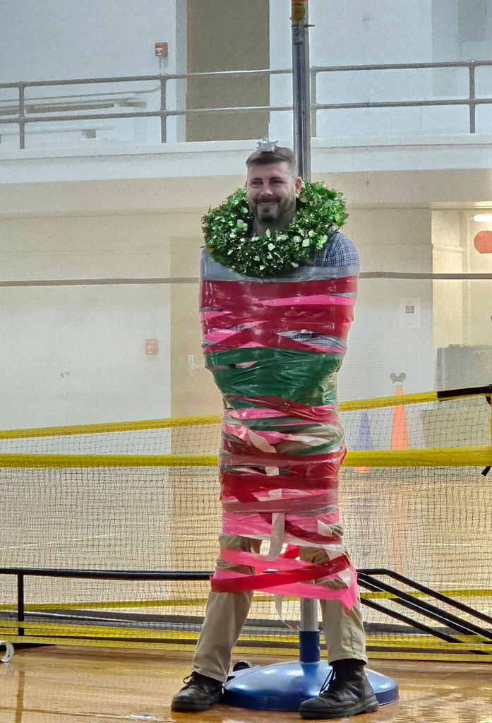 Main Street started  Friday with a little fun!! The students and staff collected 119 toys for the Toys for Tots organization. If they reached 100 toys, the students were able to vote on a staff member to Duct Tape to the pole. The winner of such an honor was none other that Mr. King!! Congratulations Mr. King!!!