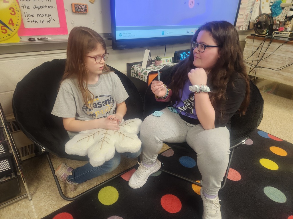 We have been learning about how to round to the nearest 10 and 100.  One of the students' favorite games to play is called Grab It, where I say a number and what it rounds to and they have to try to be the first one to "grab" it from the chart.  The first one to grab it wins the round.  Teams with the most points at the end of the game wins.  We have also been continuing to work on memorizing our multiplication facts.  I included a few pictures of students quizzing each other on their facts. Students are working on earning an ice cream party at the end of the year by memorizing each of their time tables.