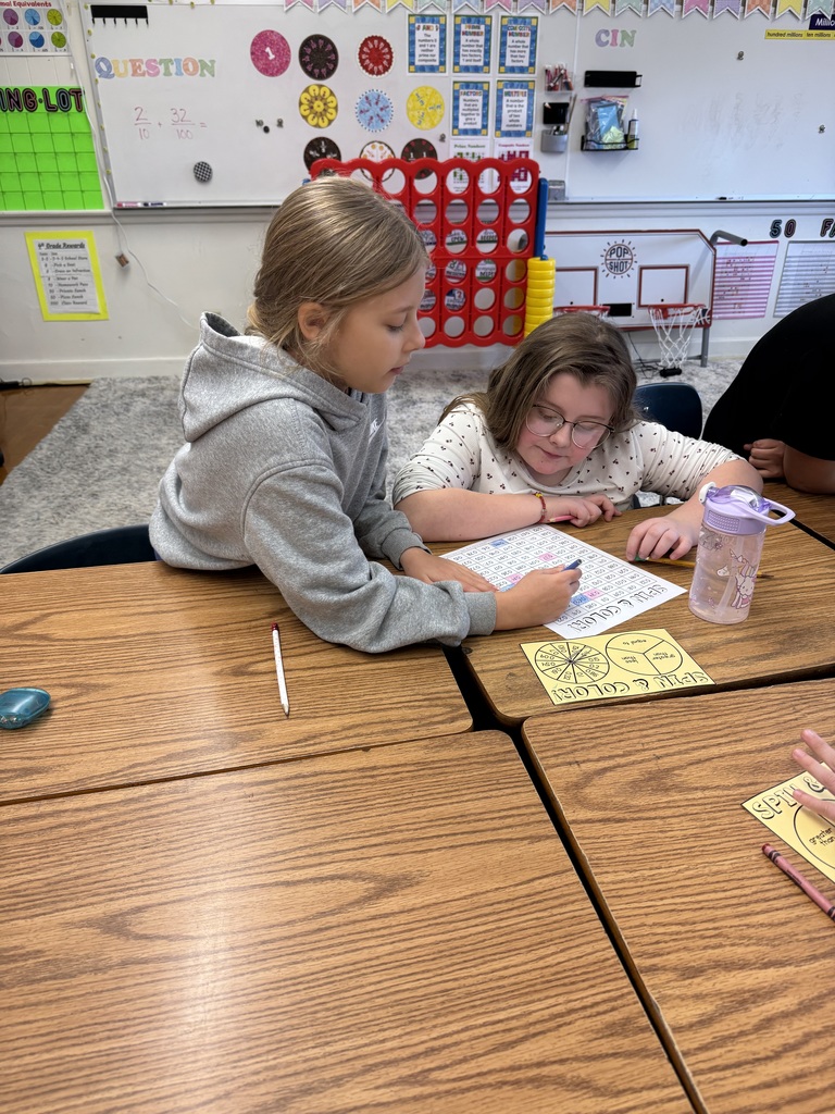 Mrs. Baker’s class using games to learn and practice comparing decimals. 