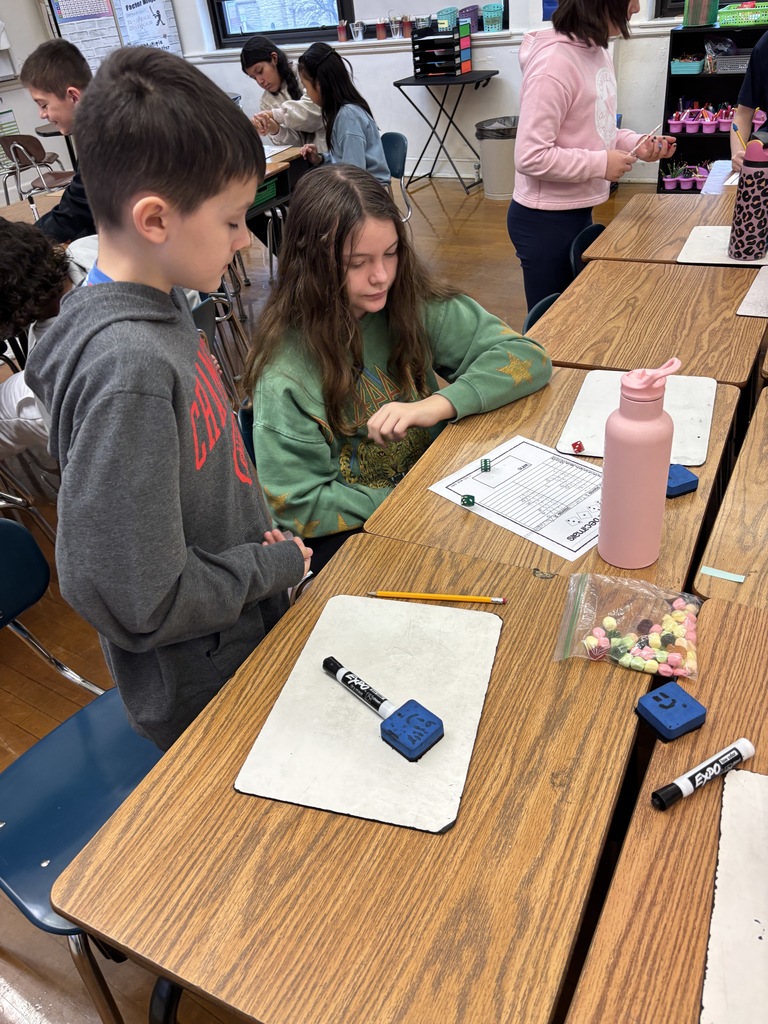 Mrs. Baker’s class using games to learn and practice comparing decimals. 