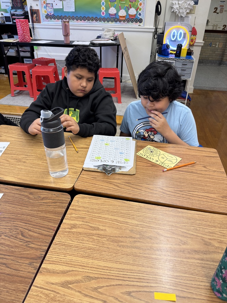 Mrs. Baker’s class using games to learn and practice comparing decimals. 