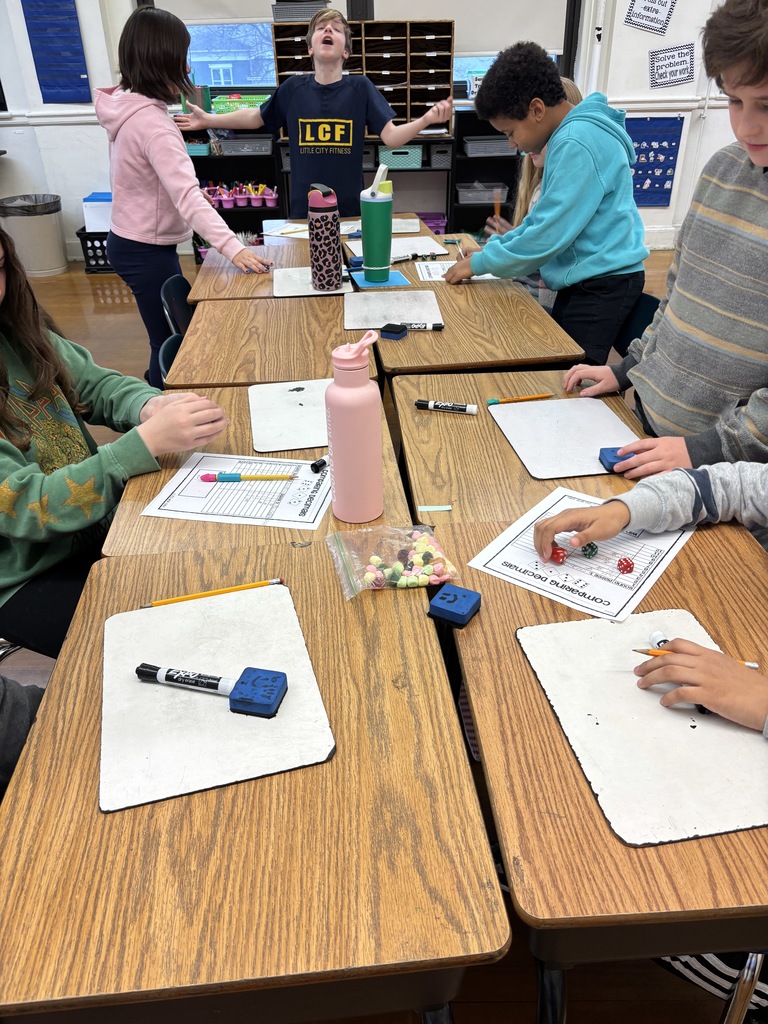 Mrs. Baker’s class using games to learn and practice comparing decimals. 