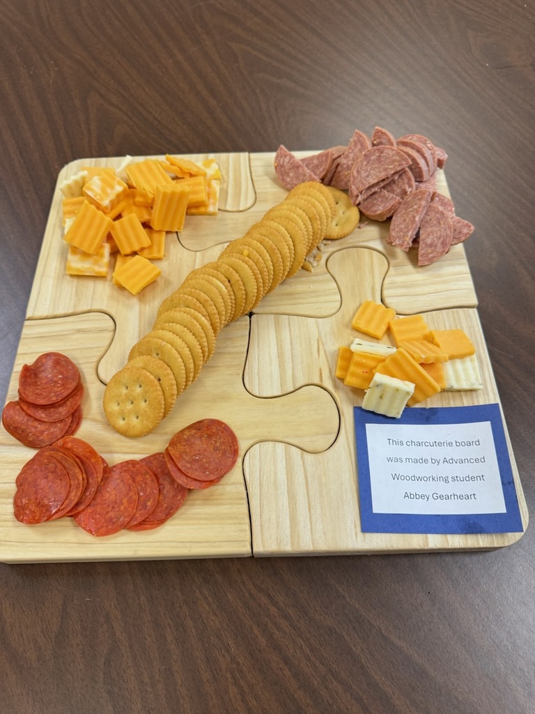 Advanced Woodworking students' projects with the staff. Abbey Gearheart and Ethan Bogard made some really awesome charcuterie boards in class.