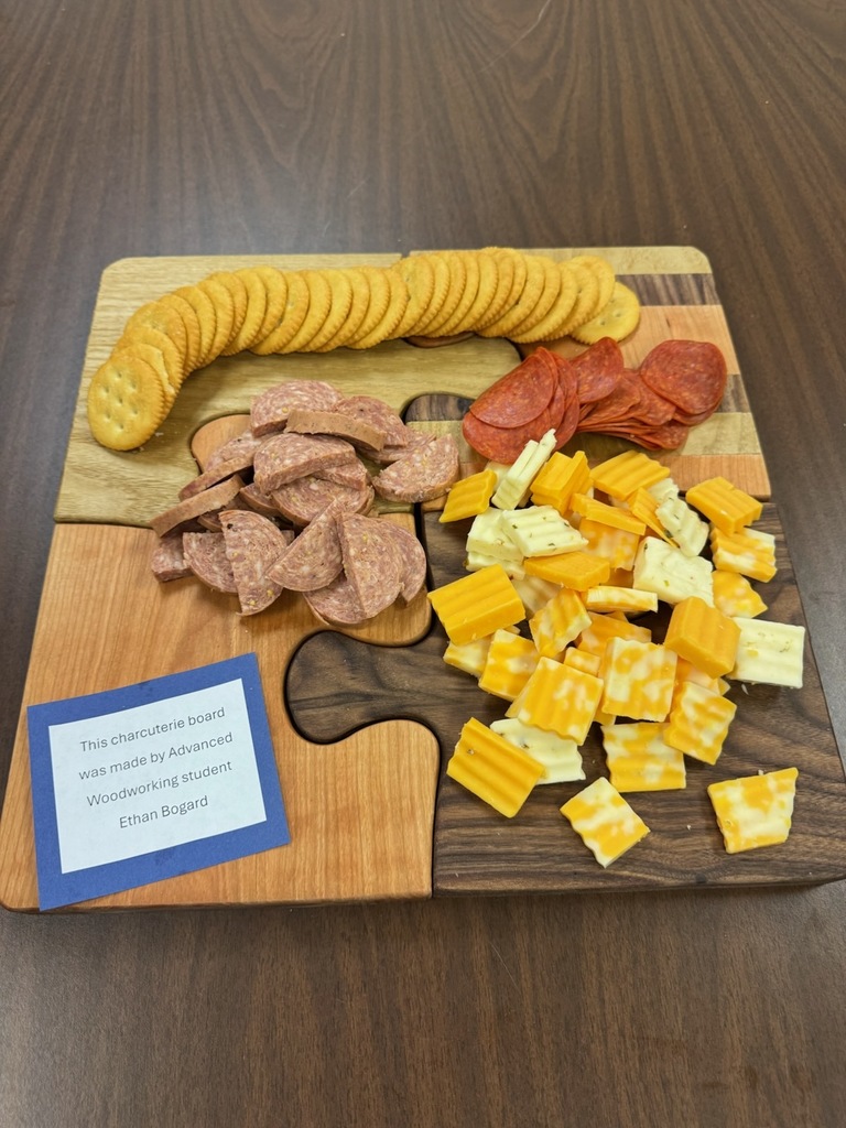 Advanced Woodworking students' projects with the staff. Abbey Gearheart and Ethan Bogard made some really awesome charcuterie boards in class.