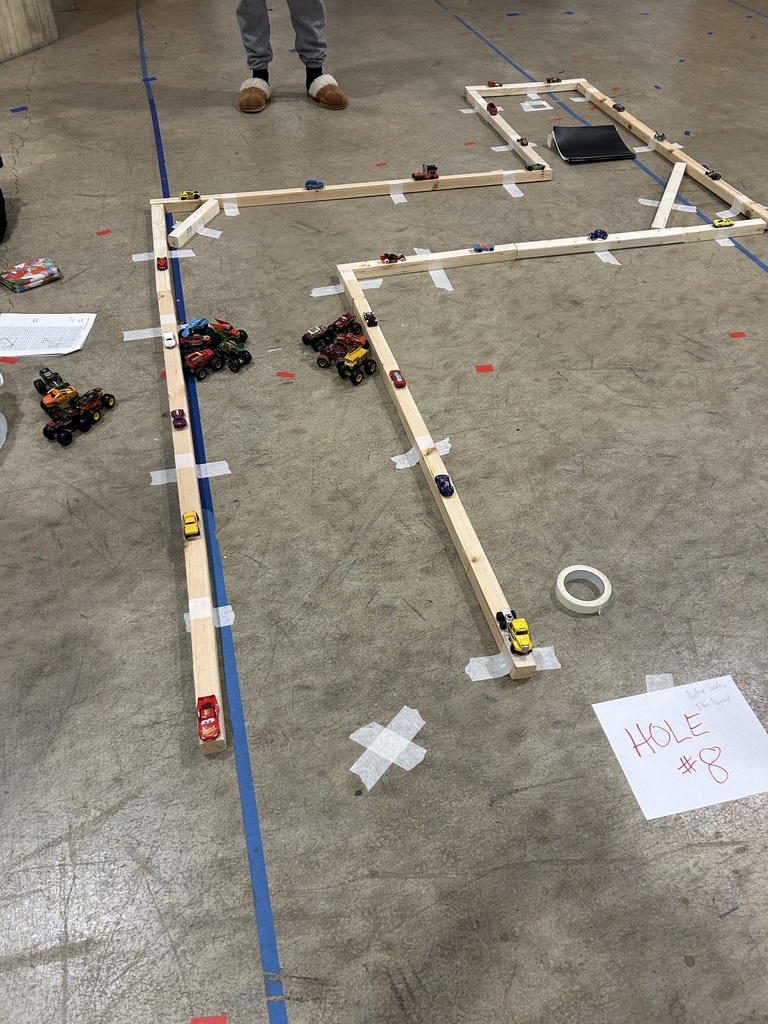 Mrs. Molnar's Advanced Quantitative Reasoning classes built a putt-putt course this week. They used the reflexive angles rules to mark the bank shots needed for a hole-in-one. Students had fun playing the course while using math concepts in real life.