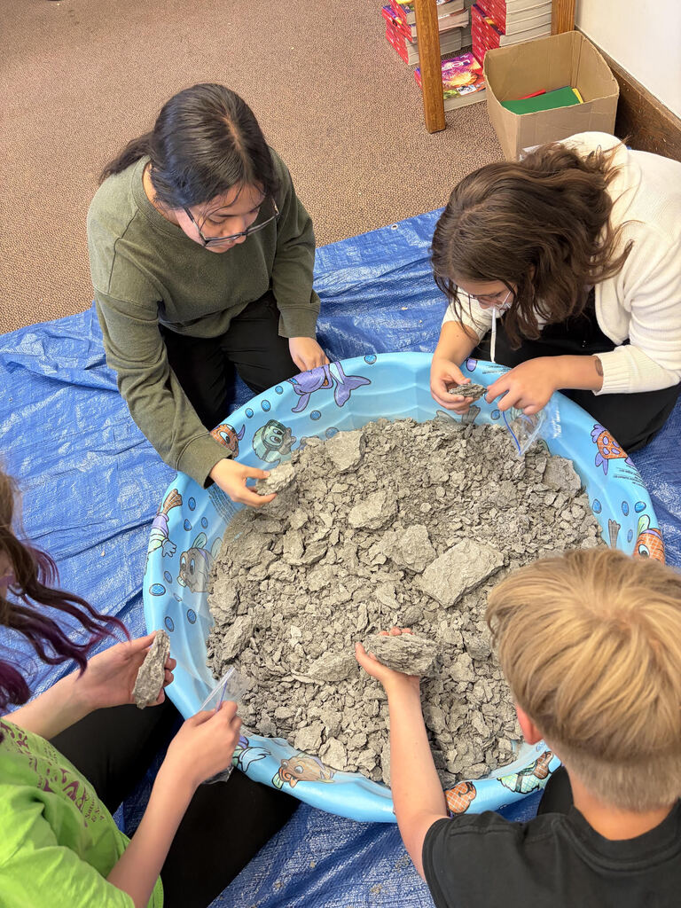Mrs. Bergman’s science class became paleontologists during a fossil dig using shale from Sylvania, Ohio! Students discovered real fossils including brachiopods, coral, and other ancient marine life hidden inside the rocks. This activity helped students learn about fossils, sedimentary rocks, and how Ohio was once covered by an ancient sea hundreds of millions of years ago. The best part — students were able to keep the fossils they found! 