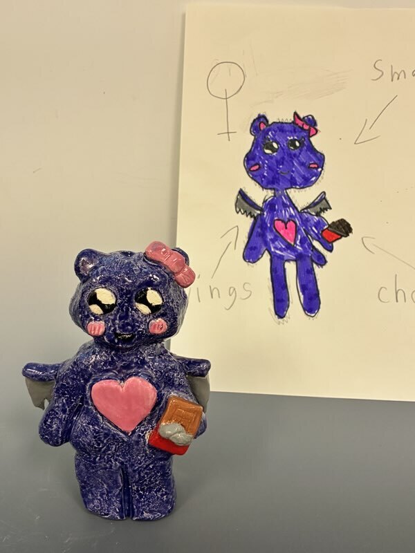 Maplehurst and NHS Art Classes Project Collaboration!  Maplehurst Art teacher Ms. Laser  read her 1st grade art class “The (not-so-scary)Book of Monsters” by Ian James Dye and then they drew their version of a (not-so-scary) monster.    Ms. Boyer’s high school sculpture class, received the drawings and then sculpted them into a 3D version based on the drawings. 
