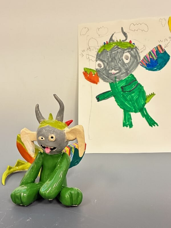 Maplehurst and NHS Art Classes Project Collaboration!  Maplehurst Art teacher Ms. Laser  read her 1st grade art class “The (not-so-scary)Book of Monsters” by Ian James Dye and then they drew their version of a (not-so-scary) monster.    Ms. Boyer’s high school sculpture class, received the drawings and then sculpted them into a 3D version based on the drawings. 