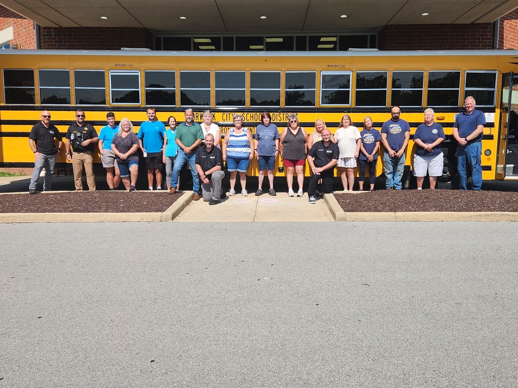 Drivers in front of a bus