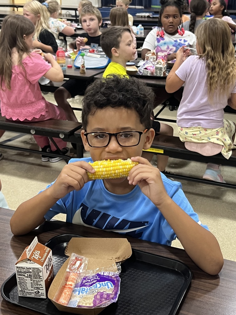 kid eating corn