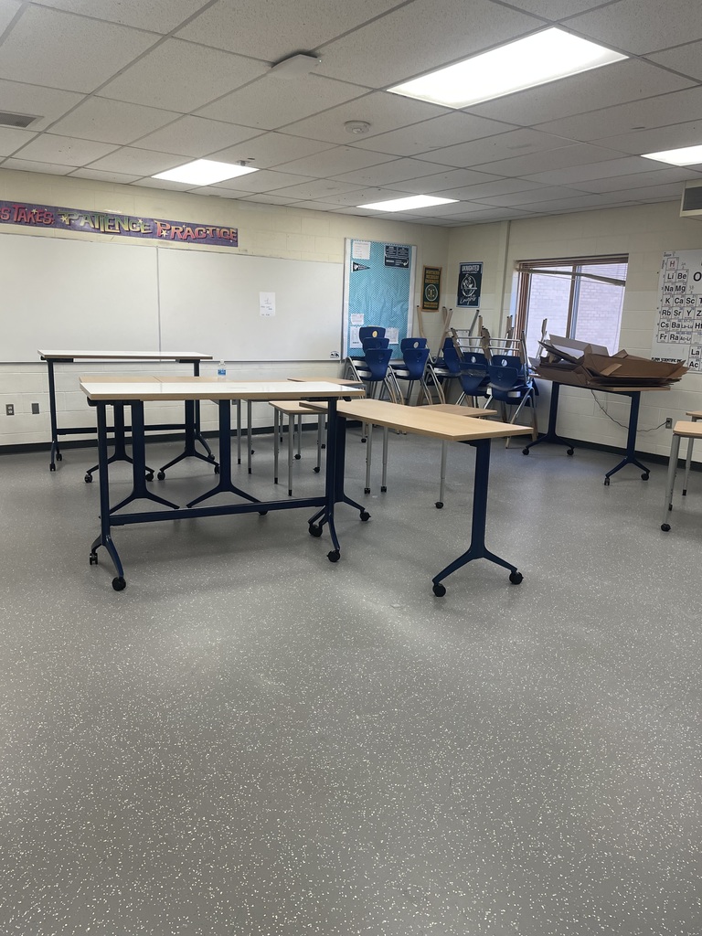 High School Classroom with new floors and Tables and chairs.
