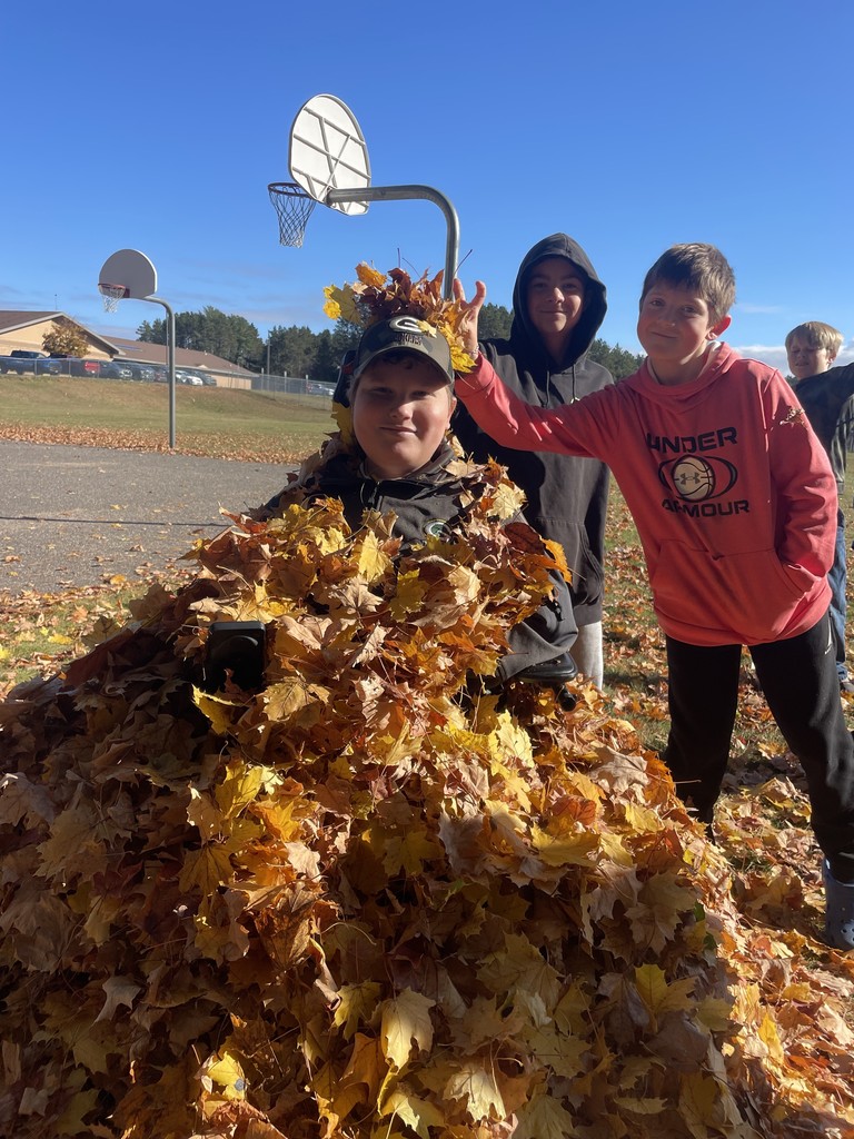 kids at recess throwing leaves at each other