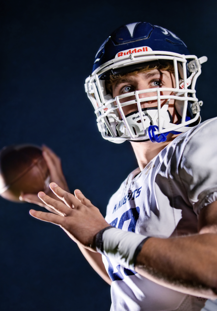 All State 1st Team Player in uniform tossing a football