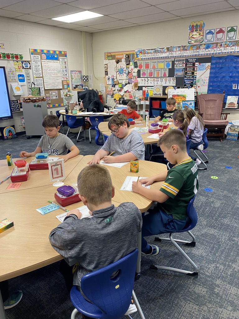 Students doing the literacy center