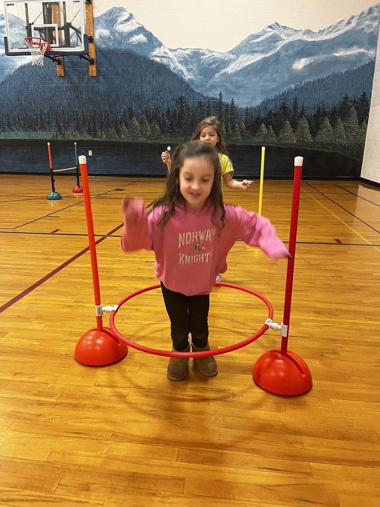 students completing an obstacle course in the gym