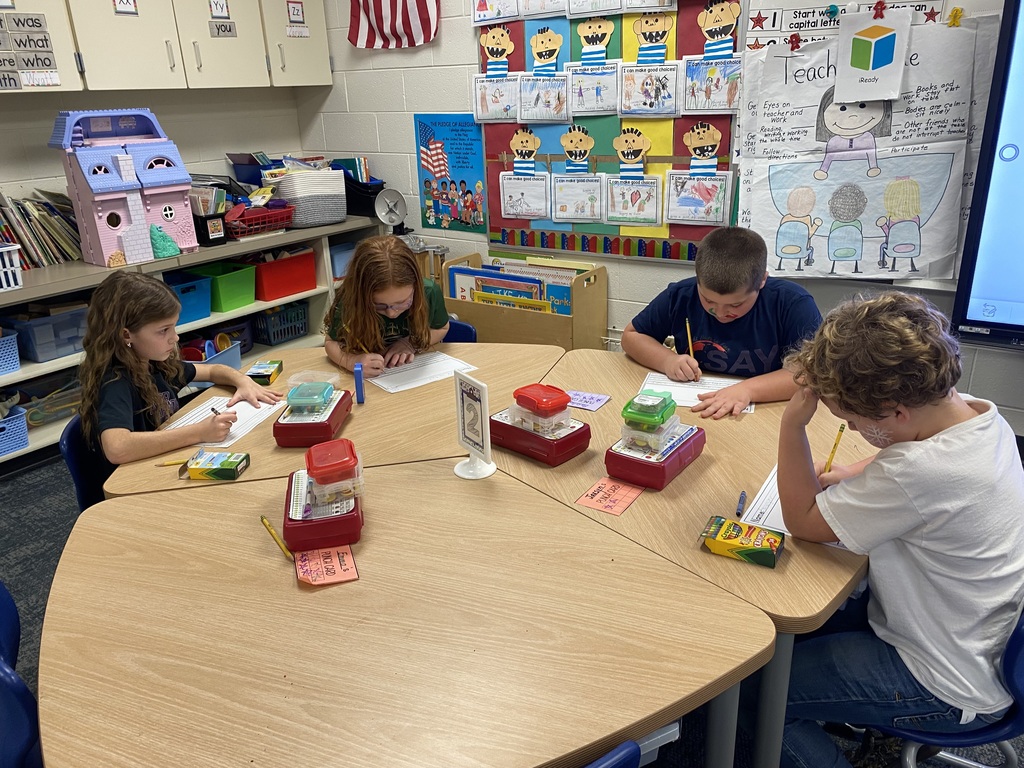 students doing literacy center activities 