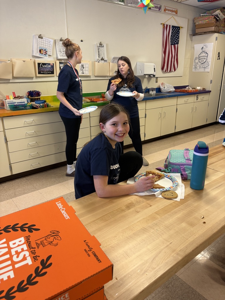 Students celebrating with pizza after reading olympics