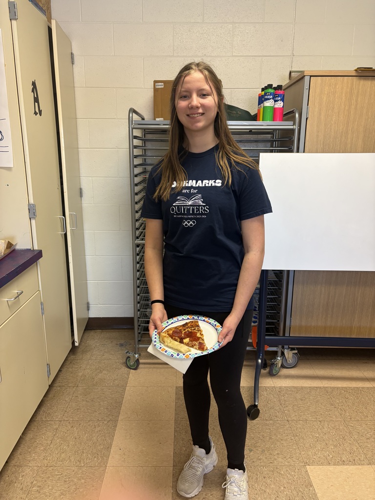 Students celebrating with pizza after reading olympics
