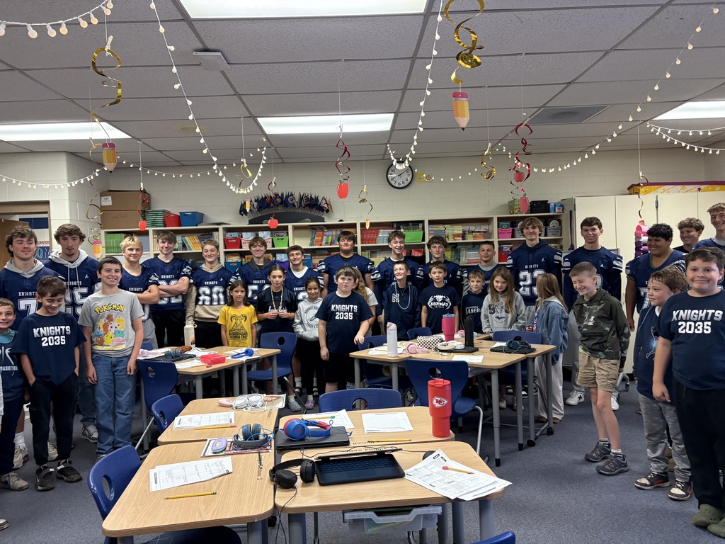 Fourth Grade Students with football players