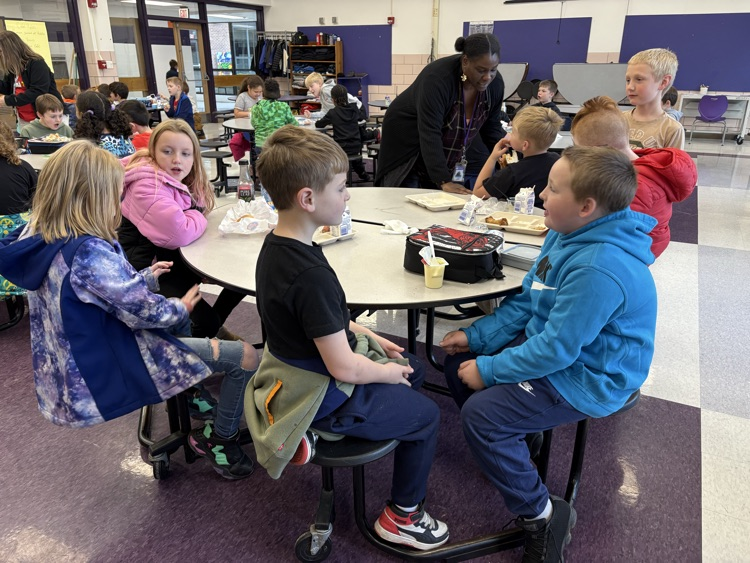 students talking at lunch