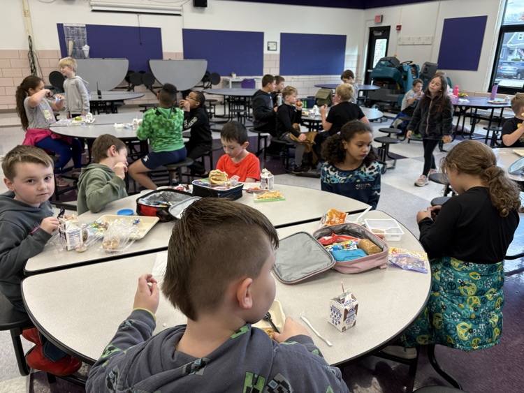students chatting with friends at lunch