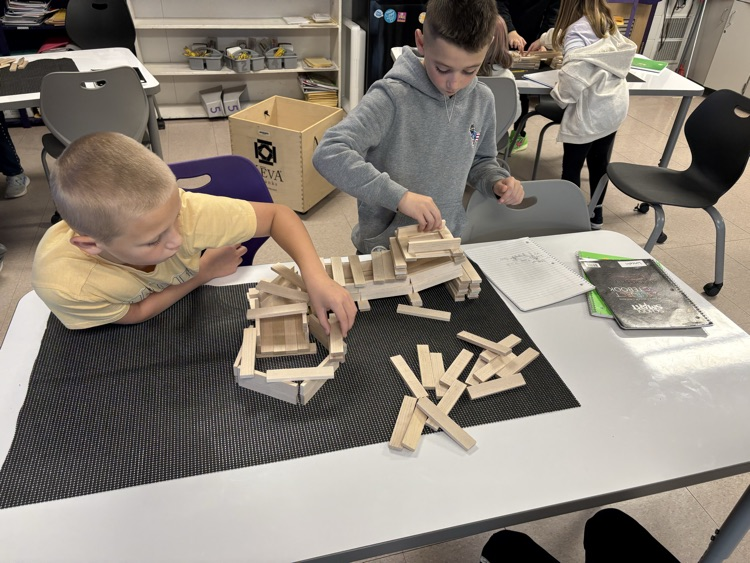 students working on roller coaster parts