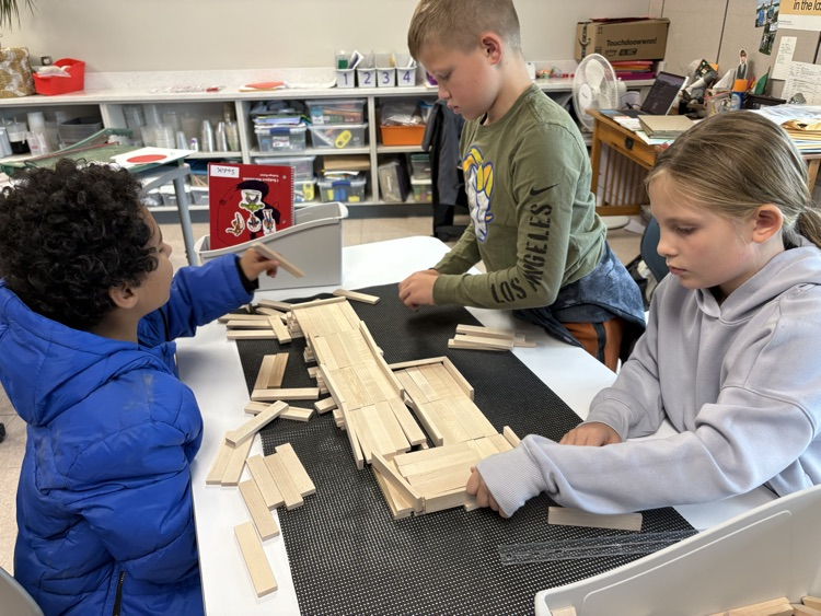 students working on roller coaster parts