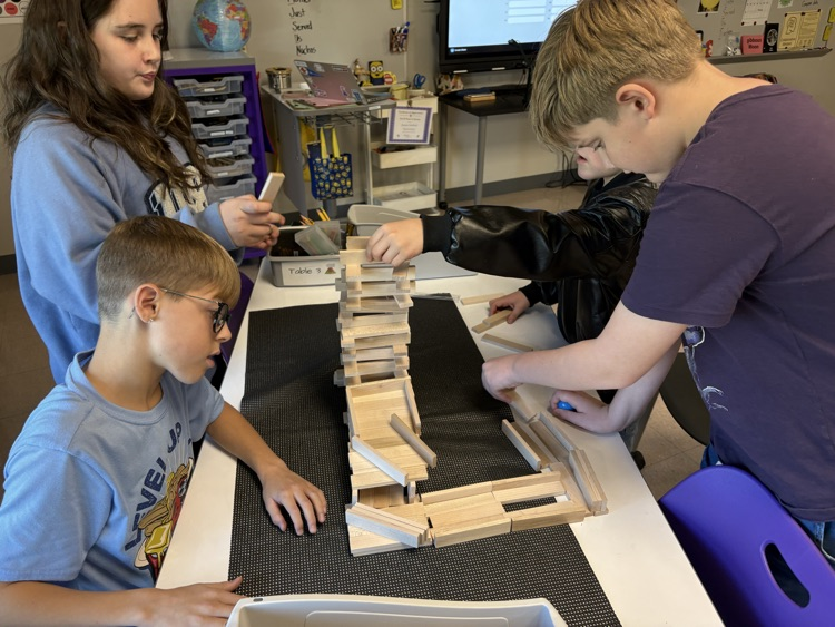 students working on roller coaster parts
