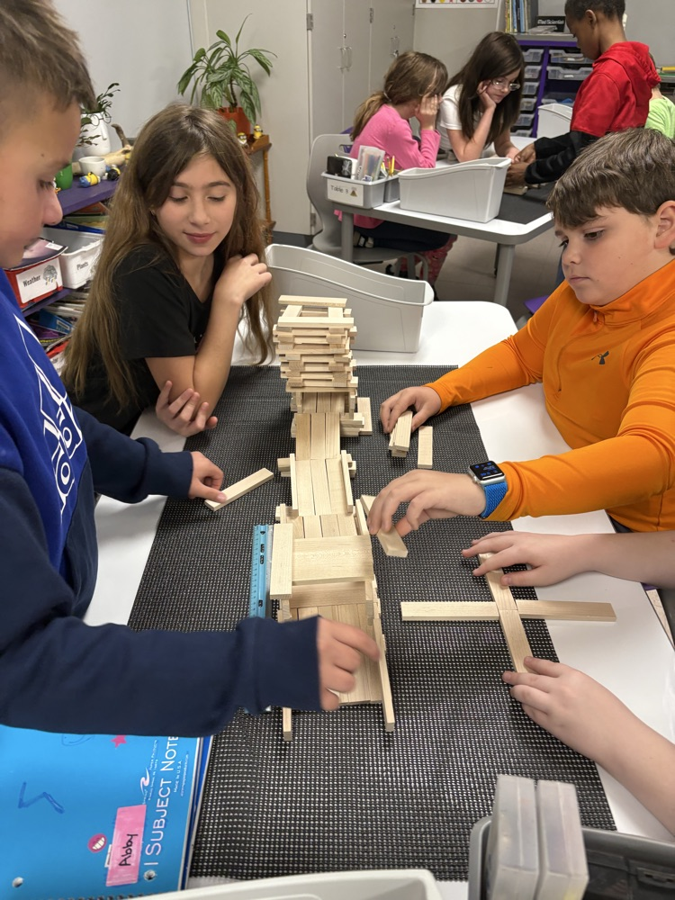 students working on roller coaster parts