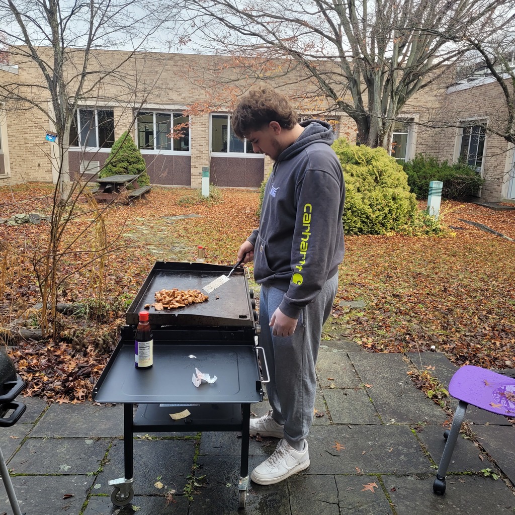 Liam White creating Hibachi style chicken in the outdoor kitchen.