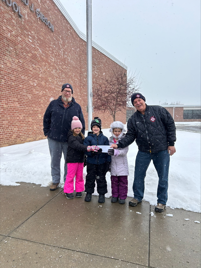 photo of norwich f.d. presenting students with check for winter gear