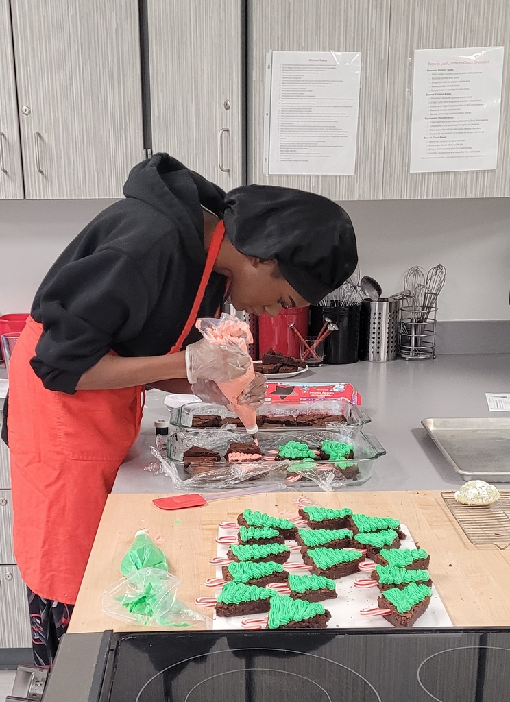 DeDe Bell puting finishing touches on Holiday Tree Brownies.