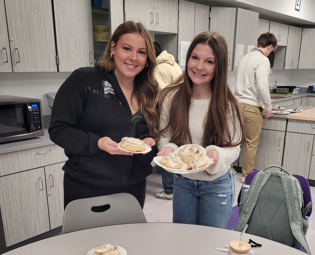 Temprance Dockray and Shaelyn Rice showing off delightful cinnamon rolls.
