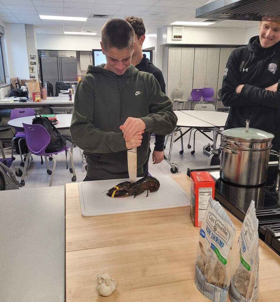 Wyeth Stafford dispatching a lobster for Lobster before cooking.
