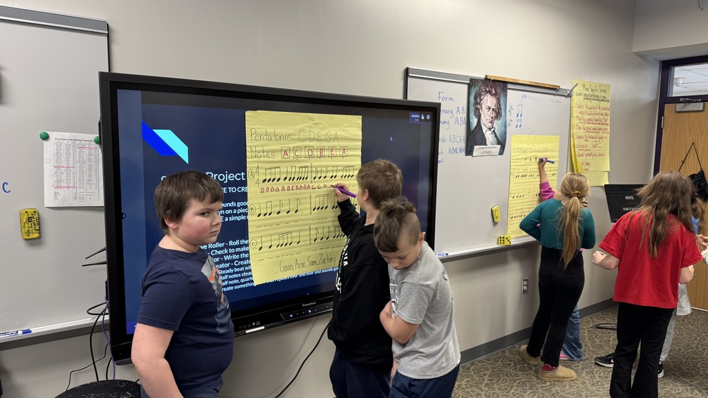 Fourth grade composers collaborating.