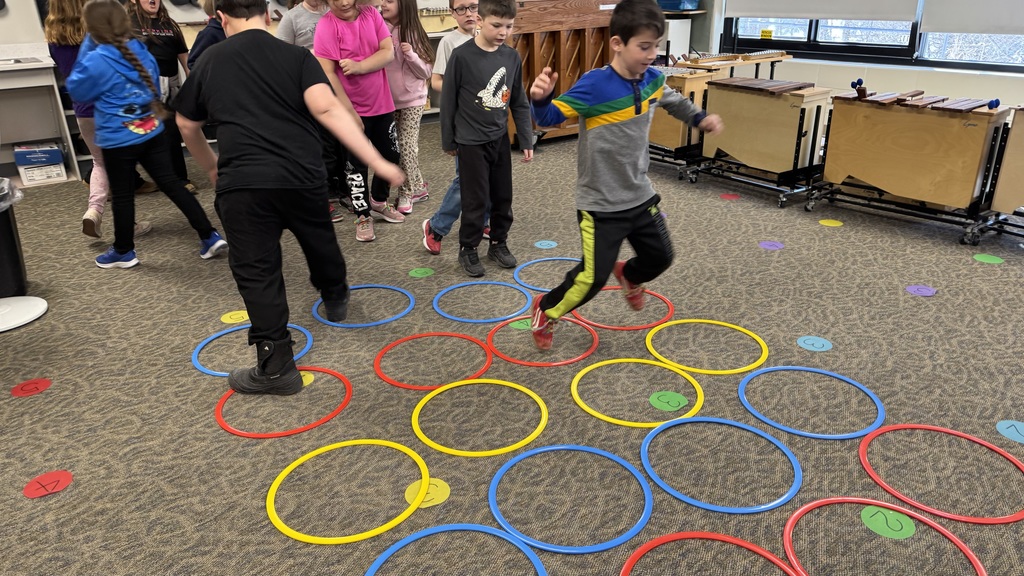 Relaxing after a composing session practicing half notes with our body with agility rings.