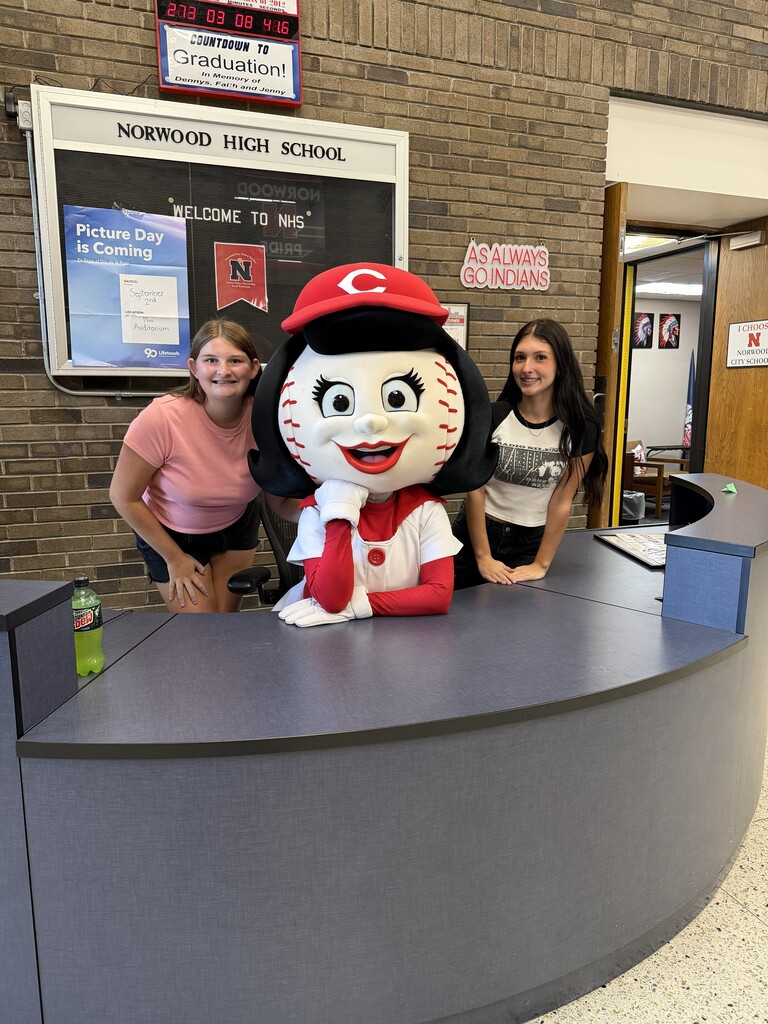 Students with Rosie Red at the Attendance desk.