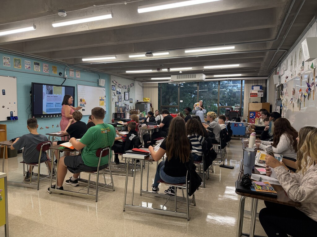 Students in classrooms as teachers go over syllabus and class expectations.