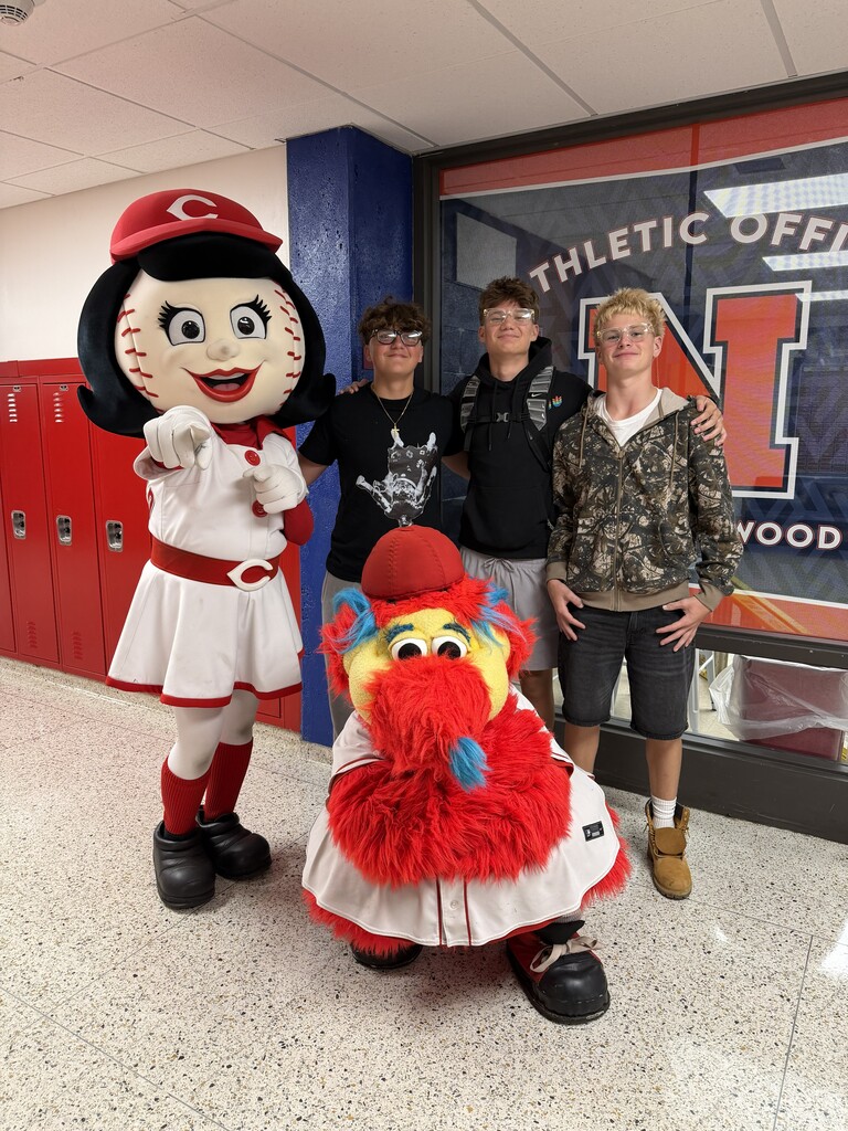 Students with Rosie Red and Gapper in front of the Athletic Office.
