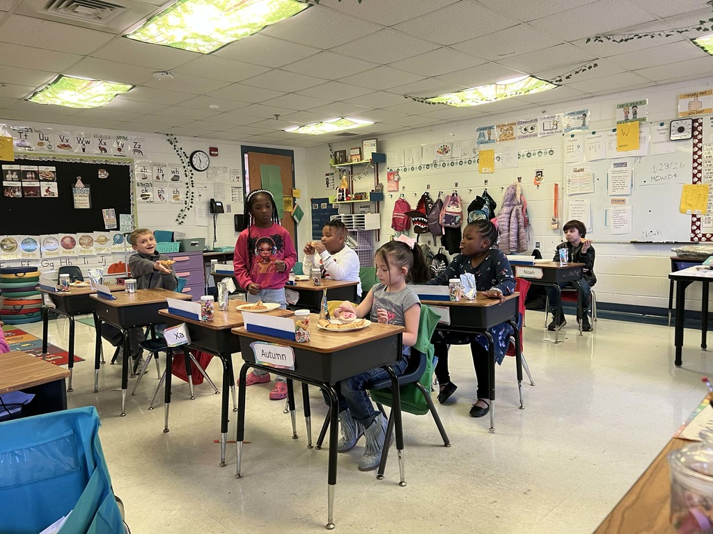 Students enjoying their pizza party.