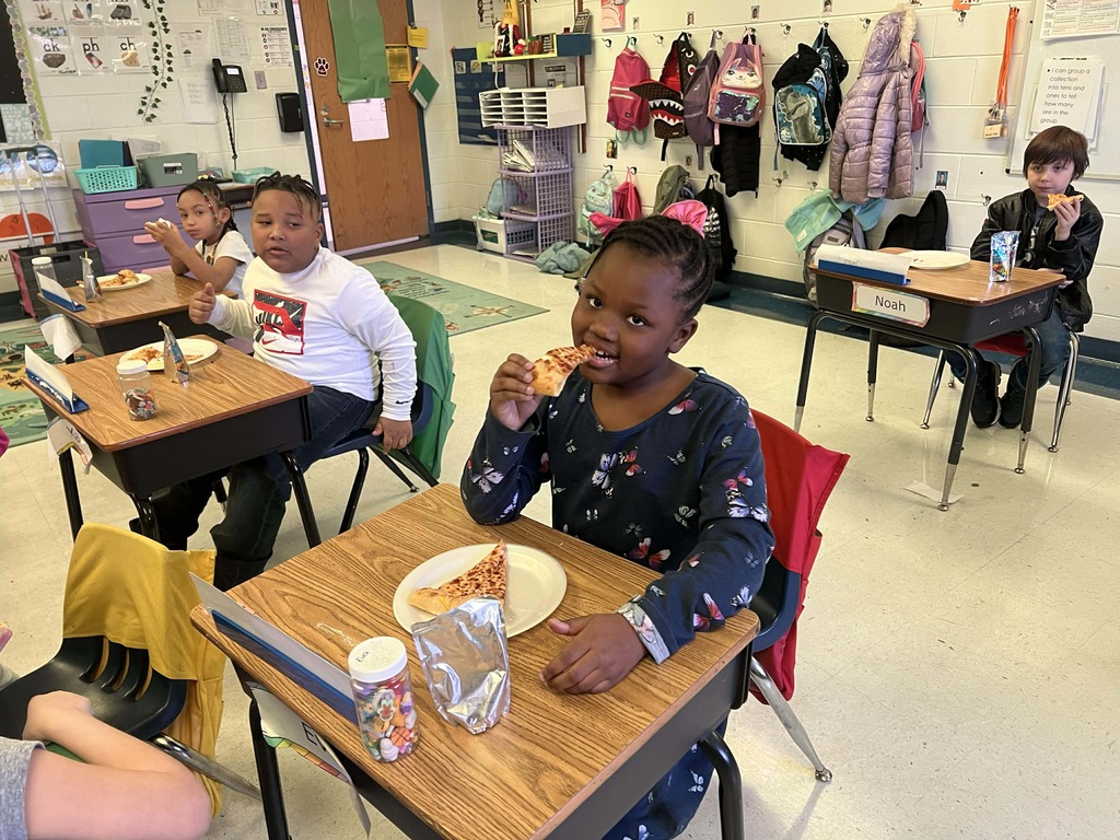 Students enjoying their pizza party.